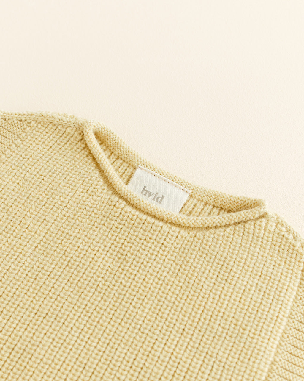 Hvid mitwachsender Baby Merino Strickpullunder Harvey in light yellow